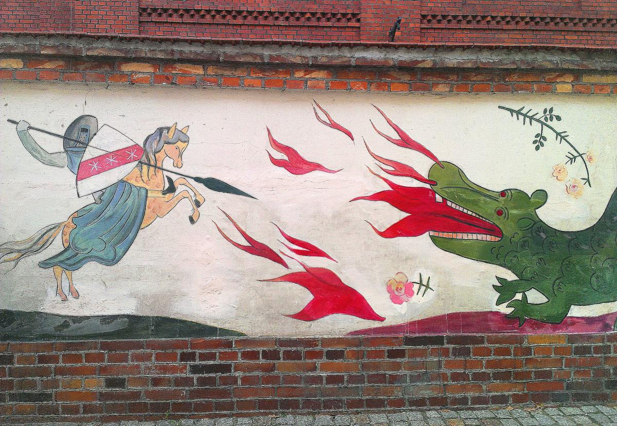 Toruński mural ze smokiem i ryczerzem